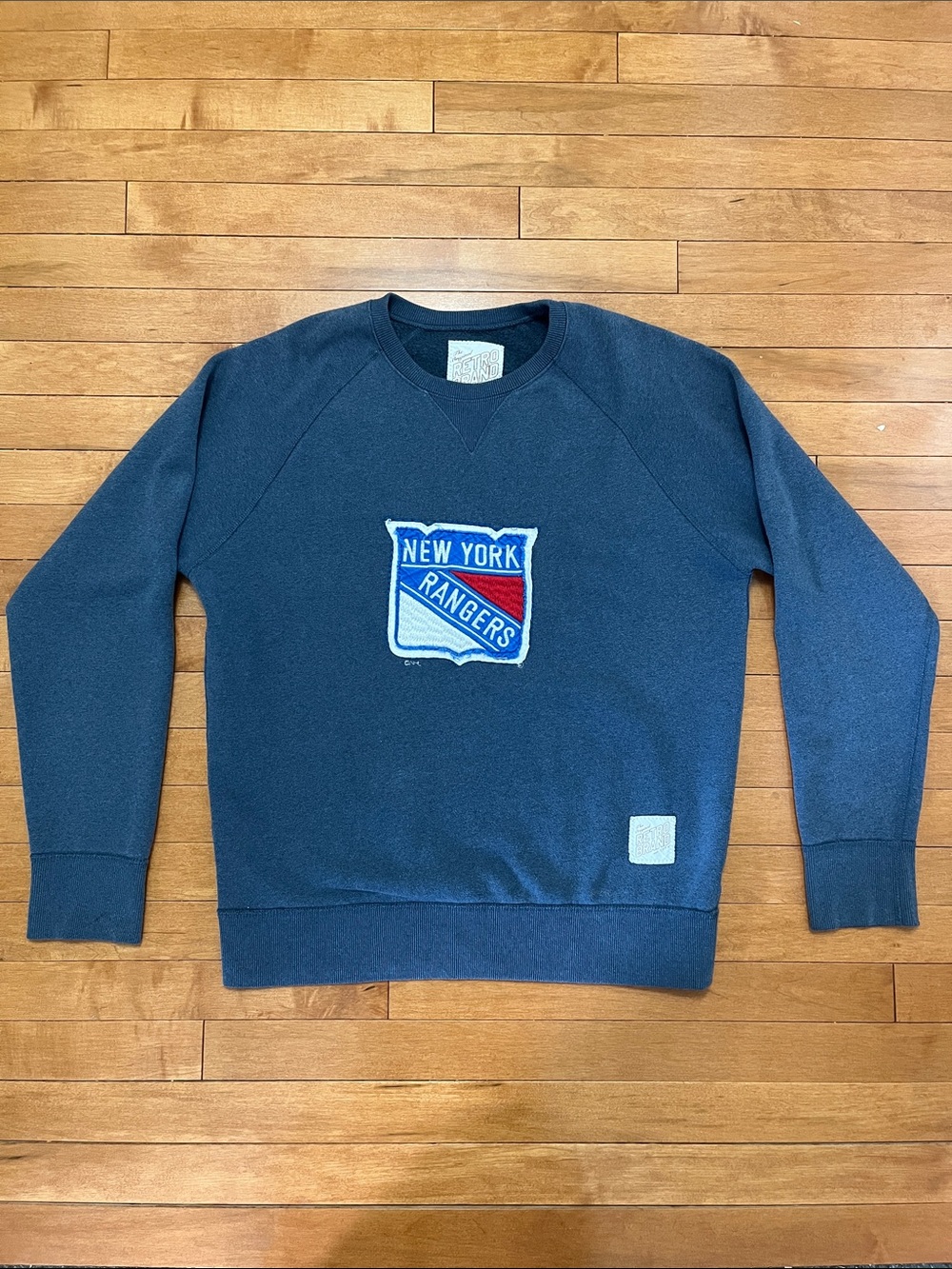 Original Retro Brand Navy Crewneck with Red & White Shield Patch